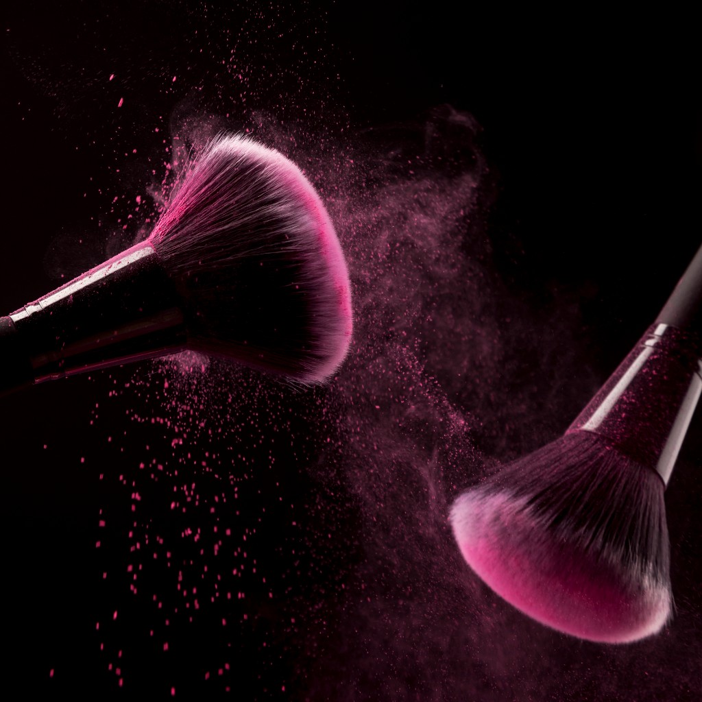 Pink makeup brushes and powder